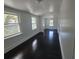 Bright hallway with two windows and dark hardwood floors at 5121 40Th N Ave, St Petersburg, FL 33709