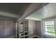 Living area features built-in shelving, large windows, and classic trim at 5121 40Th N Ave, St Petersburg, FL 33709