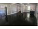 Spacious living room with hardwood floors, natural light, and adjacent kitchen at 5121 40Th N Ave, St Petersburg, FL 33709