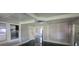 Cozy living room has recessed lighting, large windows and a view into another room at 5121 40Th N Ave, St Petersburg, FL 33709