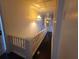 Bright staircase featuring white railings and trim with an ornamental hanging lamp at 5121 40Th N Ave, St Petersburg, FL 33709