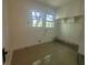 Utility room with two windows, built-in cabinets and tile floor at 5121 40Th N Ave, St Petersburg, FL 33709