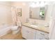 Well-lit bathroom featuring a white vanity with granite countertop and shower-tub combination at 6025 Shore S Blvd # 611, Gulfport, FL 33707