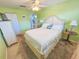 Bright bedroom featuring a double bed, neutral decor, and access to a closet and hallway at 6025 Shore S Blvd # 611, Gulfport, FL 33707