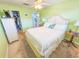 Bright bedroom featuring a double bed, neutral decor, and access to a walk-in closet and hallway at 6025 Shore S Blvd # 611, Gulfport, FL 33707
