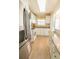 Bright kitchen with stainless steel refrigerator, white cabinets, and granite countertops at 6025 Shore S Blvd # 611, Gulfport, FL 33707