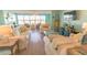 Spacious living room with plush sofas, light wood flooring, and large windows at 6025 Shore S Blvd # 611, Gulfport, FL 33707
