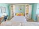 Living space with a pull-out bed and built-in shelving adjacent to a vintage writing desk at 6025 Shore S Blvd # 611, Gulfport, FL 33707