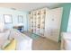 Inviting living space with a pull-out bed and built-in shelving for ample storage and display at 6025 Shore S Blvd # 611, Gulfport, FL 33707