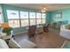 Bright living room with water views, comfortable seating, and a ceiling fan at 6025 Shore S Blvd # 611, Gulfport, FL 33707