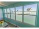 Large windows offering serene water views and filling the space with natural light at 6025 Shore S Blvd # 611, Gulfport, FL 33707