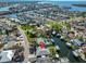Aerial view of canal front home showcases a private pool and dock, set in a coastal community at 6324 Balboa Ln, Apollo Beach, FL 33572