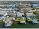 Aerial view of a waterfront home with a dock and a lush backyard, nestled in a charming canal community at 6324 Balboa Ln, Apollo Beach, FL 33572
