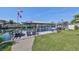 Features a covered boat dock and plenty of seating to enjoy waterfront views at 6324 Balboa Ln, Apollo Beach, FL 33572