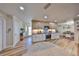 Modern kitchen with stainless steel appliances, granite countertops, and wood flooring at 6324 Balboa Ln, Apollo Beach, FL 33572