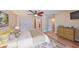 Bright main bedroom with wood floors, a ceiling fan, and ample closet space, creating a comfortable retreat at 6324 Balboa Ln, Apollo Beach, FL 33572