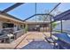 Screened-in lanai boasts a full outdoor kitchen, bar, and lounge area, perfect for entertaining at 6324 Balboa Ln, Apollo Beach, FL 33572