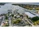 Waterfront aerial view showing a marina, boats, and waterfront homes with neighborhood parking and greenery at 6324 Balboa Ln, Apollo Beach, FL 33572