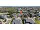 Stunning aerial view of a property nestled in a peaceful neighborhood near a tranquil lake at 7133 Hatpin Loop, Wesley Chapel, FL 33545