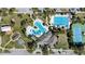 A birds eye view of a vibrant community, including swimming pools, tennis courts, and basketball court at 7133 Hatpin Loop, Wesley Chapel, FL 33545