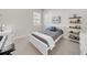 Bright bedroom featuring carpet, a window and neutral walls, creating a cozy and inviting space at 7133 Hatpin Loop, Wesley Chapel, FL 33545