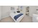 Bright bedroom with natural light, featuring white furniture and a blue accent blanket at 7133 Hatpin Loop, Wesley Chapel, FL 33545