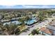 Aerial view of a luxurious community pool, tennis courts, and well-maintained grounds, perfect for active living at 7133 Hatpin Loop, Wesley Chapel, FL 33545