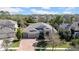 Beautiful single-Gathering home boasts mature landscaping and a three-car garage at 7133 Hatpin Loop, Wesley Chapel, FL 33545