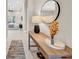 Hallway with console table, flowers, and a modern mirror at 7133 Hatpin Loop, Wesley Chapel, FL 33545