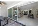 Open-concept living space seamlessly connects the indoor and outdoor areas for modern living at 7133 Hatpin Loop, Wesley Chapel, FL 33545