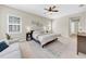 Comfortable main bedroom with lots of light and a ceiling fan at 7133 Hatpin Loop, Wesley Chapel, FL 33545