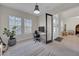 Bright office space with an office desk, a large window, and a stylish doorway at 7133 Hatpin Loop, Wesley Chapel, FL 33545