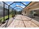 Covered patio with ample seating, perfect for enjoying the outdoors and backyard views at 7133 Hatpin Loop, Wesley Chapel, FL 33545