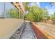 View of the backyard showcasing a concrete walkway and colorful landscape at 7183 Fireside St, Spring Hill, FL 34606
