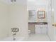 Bathroom featuring a tub, shower, vanity with storage, and coordinated fixtures at 7183 Fireside St, Spring Hill, FL 34606