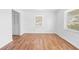 Bedroom featuring wood-look flooring and natural light from dual windows at 7183 Fireside St, Spring Hill, FL 34606