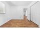 Cozy bedroom features wood floors, closet, and abundant natural light at 7183 Fireside St, Spring Hill, FL 34606