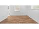 Bright bedroom featuring wood flooring and natural light at 7183 Fireside St, Spring Hill, FL 34606