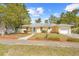 Charming yellow single-story home featuring an attached one-car garage and a well-maintained front yard at 7183 Fireside St, Spring Hill, FL 34606
