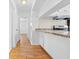 Modern kitchen boasts updated appliances and wooden flooring at 7183 Fireside St, Spring Hill, FL 34606