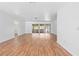 Expansive living area with wood-look floors and sliding glass doors offering views of the outdoors at 7183 Fireside St, Spring Hill, FL 34606