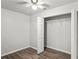 Bedroom with wood-look floors, a ceiling fan, and walk-in closet at 801 Chess Pl, Seffner, FL 33584