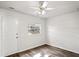 Sunlit bedroom featuring modern flooring, ceiling fan, and a door to the outside at 801 Chess Pl, Seffner, FL 33584