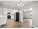 Stylish open-concept kitchen with stainless appliances and connection to a cozy living space at 801 Chess Pl, Seffner, FL 33584