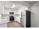 Modern kitchen featuring stainless steel appliances, white cabinets, and ample counter space at 801 Chess Pl, Seffner, FL 33584