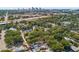 Enjoy this vibrant city skyline view of home among a neighborhood full of trees at 810 22Nd N St, St Petersburg, FL 33713