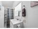 Cozy bathroom with shower/tub, bright window, toilet paper holder, and towel rack at 810 22Nd N St, St Petersburg, FL 33713