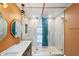 Bathroom featuring double sinks and an oversized glass enclosed shower with marble tile at 810 22Nd N St, St Petersburg, FL 33713