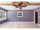 Spacious bedroom with a decorative ceiling fan, lots of natural light, and hardwood floors at 810 22Nd N St, St Petersburg, FL 33713