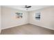 Bright bedroom features light gray flooring, neutral walls and ceiling fan at 810 22Nd N St, St Petersburg, FL 33713